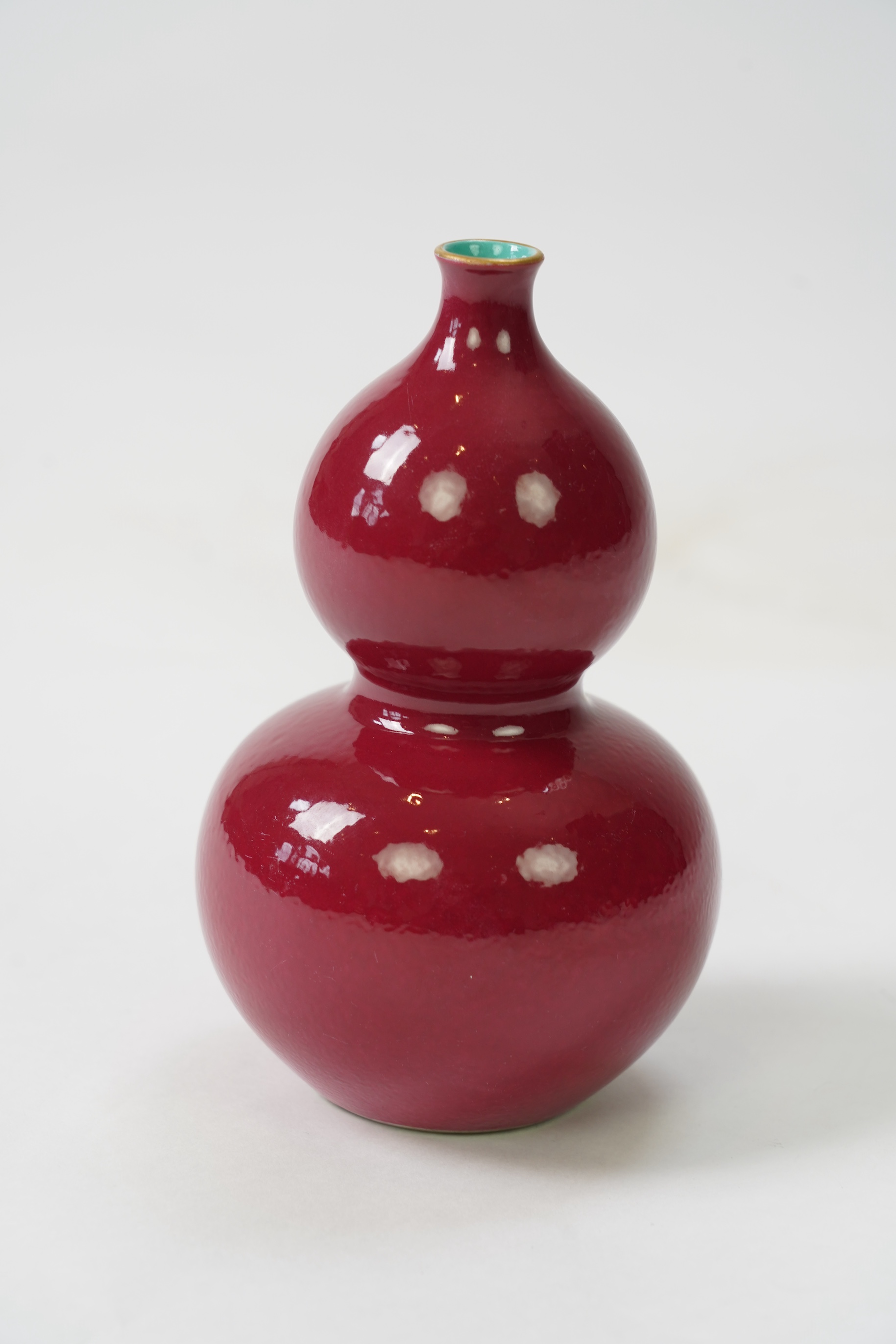 A Chinese ruby ground double gourd vase, Qianlong seal mark but later